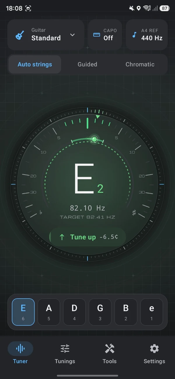 TuneForge tuner reading E2 at 82.10 hertz against a target of 82.41 hertz, prompting Tune up at minus 6.5 cents